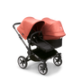 Bugaboo Donkey 5 Duo seat and bassinet stroller with graphite chassis, midnight black fabrics and sunrise red sun canopy. - Thumbnail Slide 1 of 12