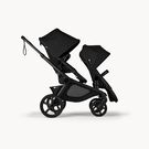 Bugaboo Kangaroo 2-in-1 tandem stroller with two seats, with Midnight Black fabrics and Midnight Black sun canopies.