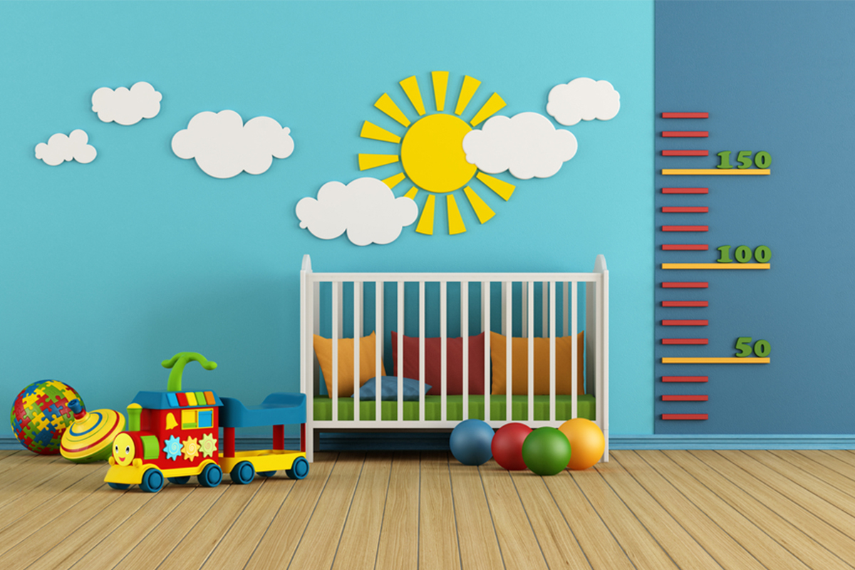 Colorful nursery with sunshine and clouds on wall