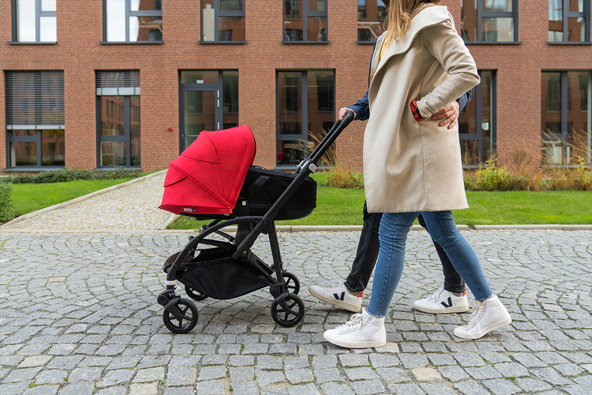 Couple going for a walk with their baby