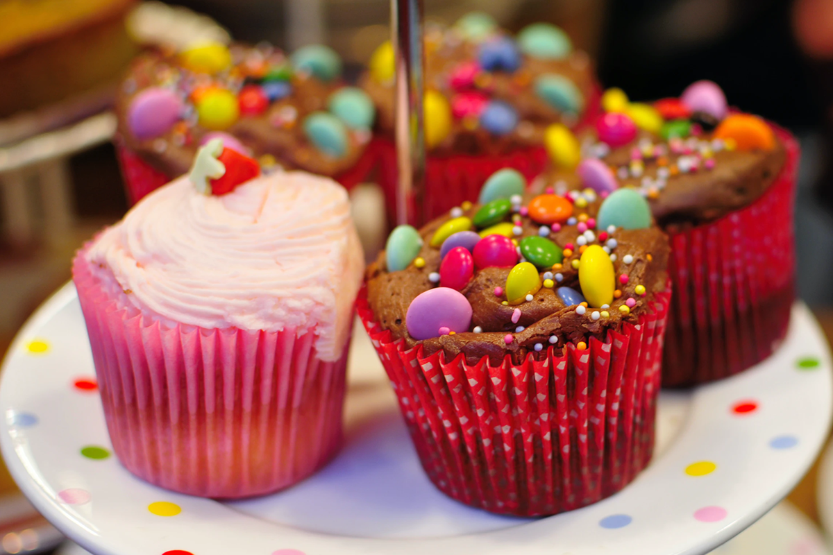 Colorful cupcakes to go along with several baby shower themes