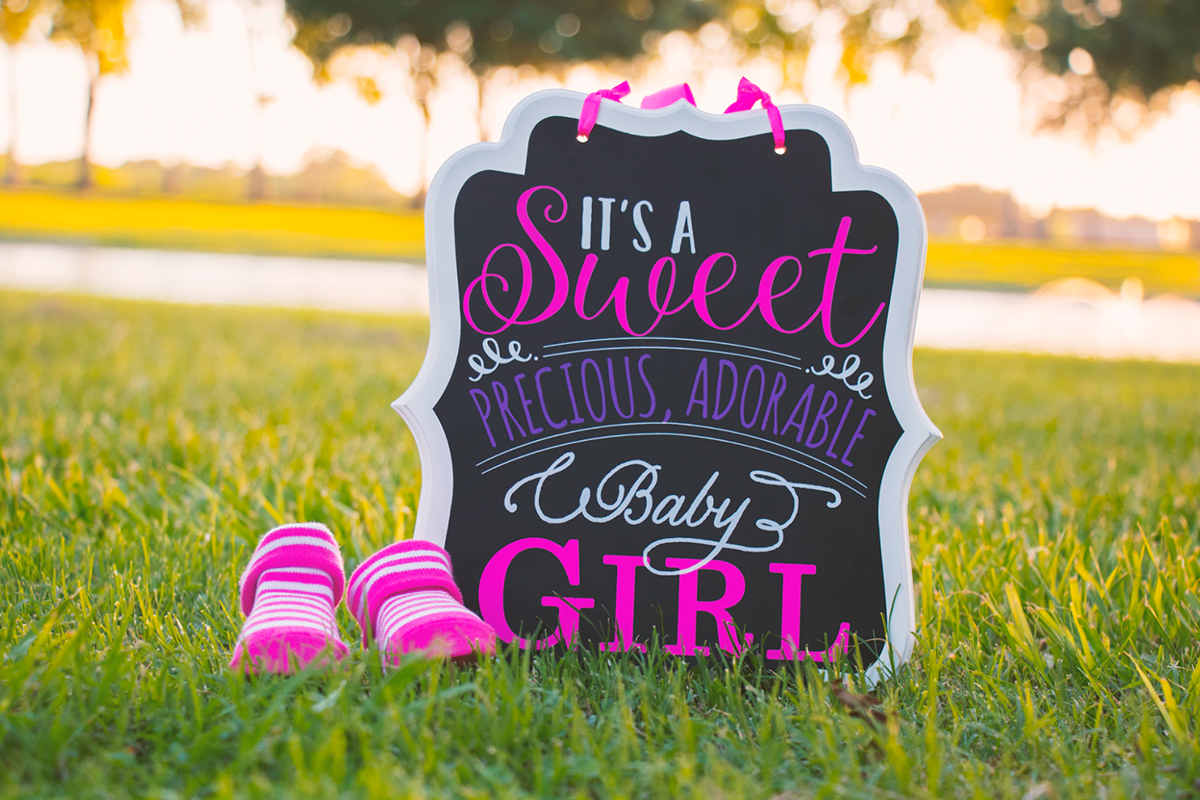 “It’s a sweet baby girl” sign welcoming people to a baby shower