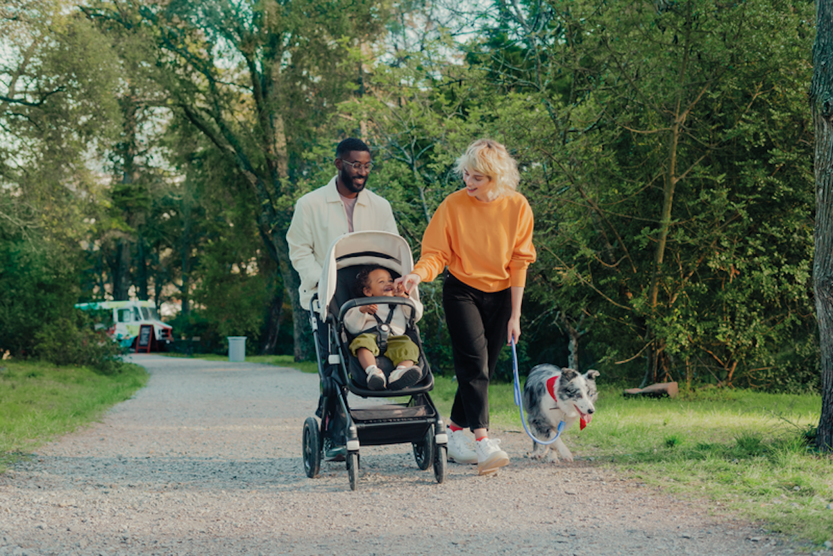 Family walking with baby in stroller