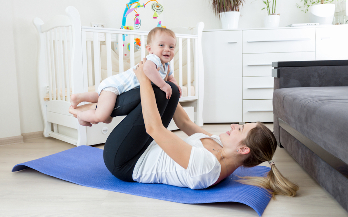 Woman doing exercises with baby