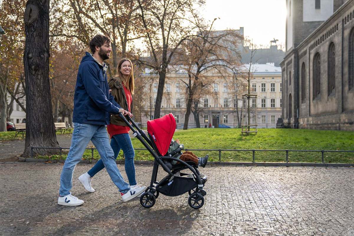 Couple walking in the city with a Bugaboo stroller