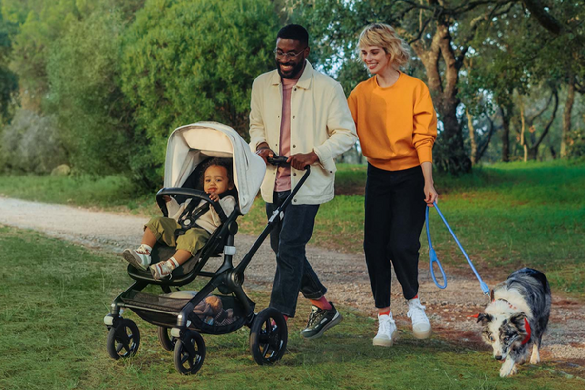 Family walking in the park with a Bugaboo stroller