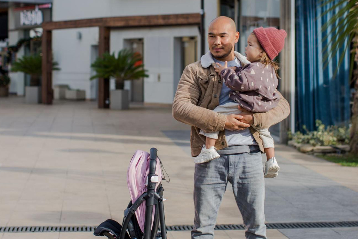 Dad with baby in city