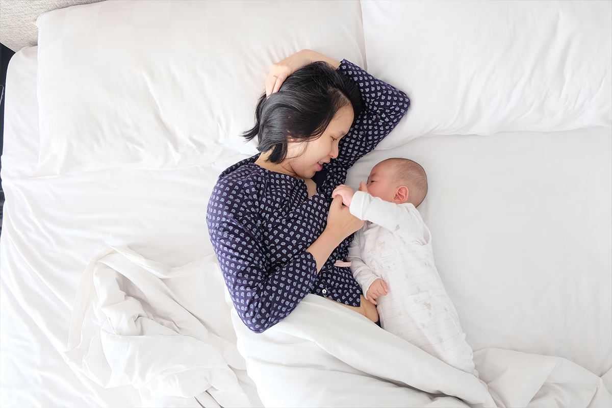 Mother breastfeeding her baby during the fourth trimester