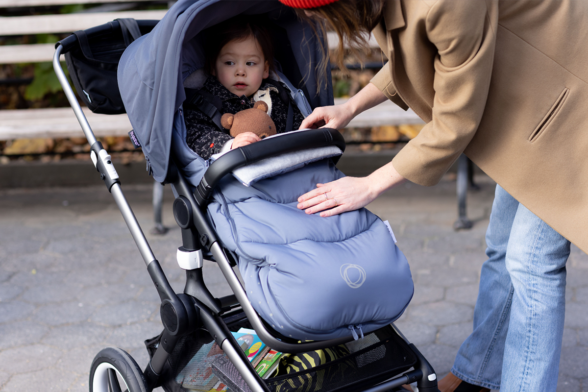 Child with winter stroller accessories